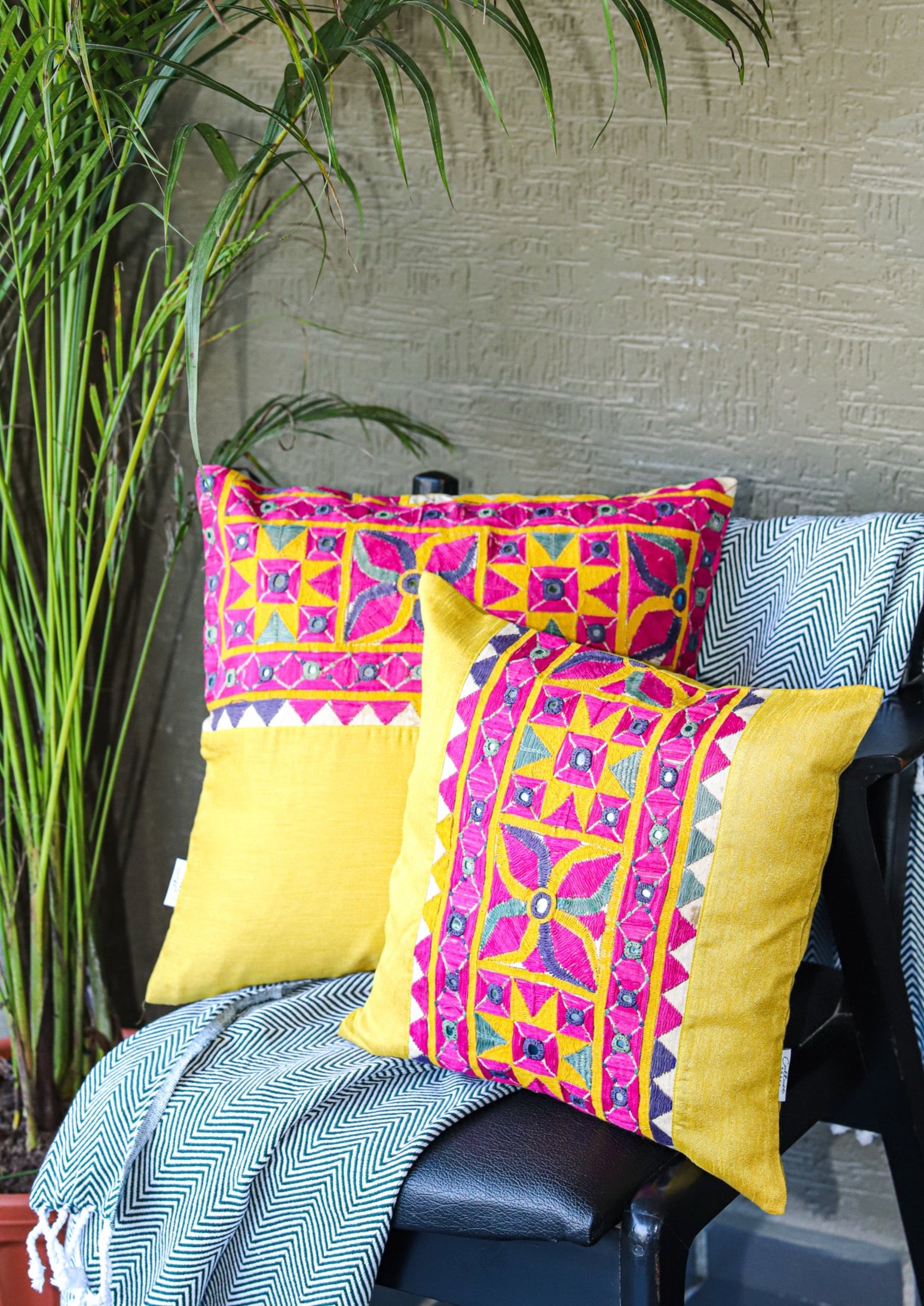 "Vintage Kutch embroidery panel cushion cover featuring intricate traditional designs in vibrant colors, available in sizes 16x16 and 18x18 inches. Perfect for adding a touch of ethnic charm to your home decor."