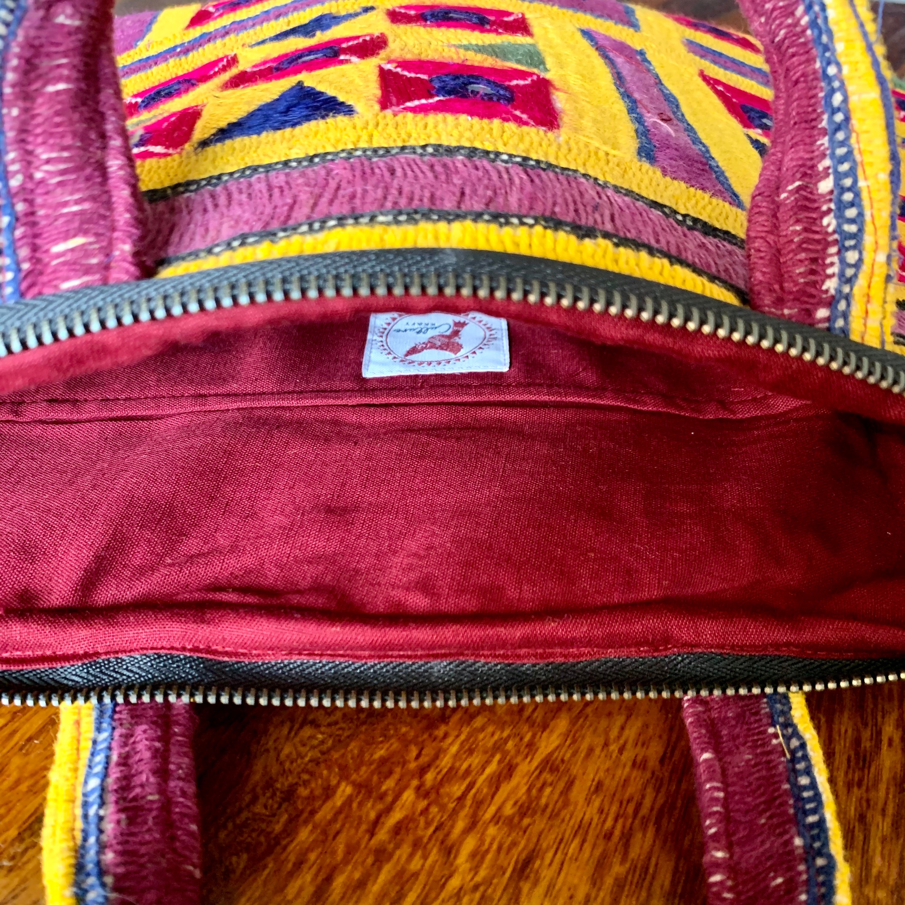 "ABHLA - Vintage Kutch Embroidery Laptop Bag with intricate, vibrant traditional designs, showcasing handcrafted details and cultural artistry."