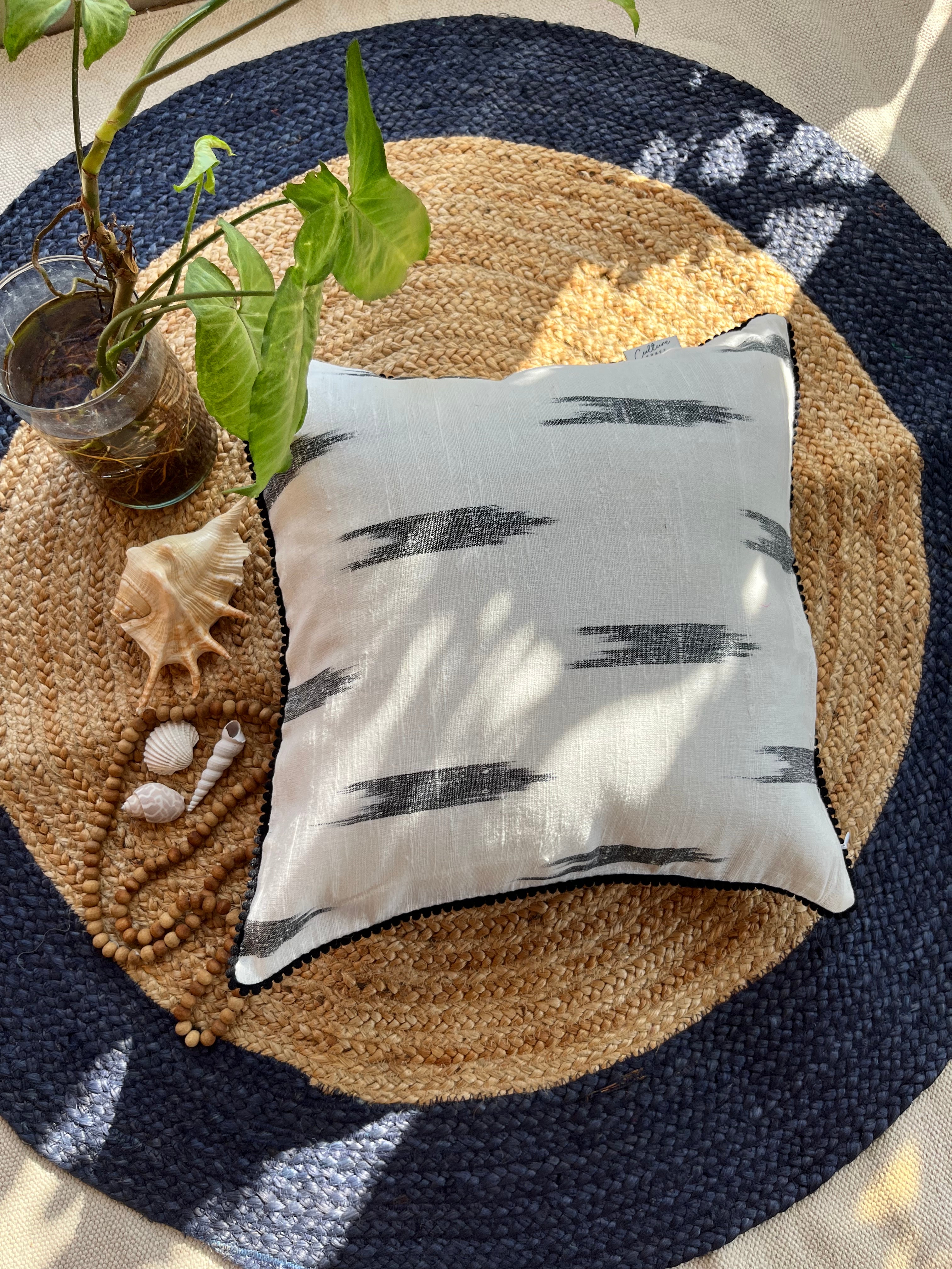 "VAAN Jute Cotton Ikat Cushion Cover available in 16x16 and 18x18 sizes, featuring a vibrant ikat pattern with a blend of jute and cotton fabric, perfect for adding a touch of bohemian charm to any living space."