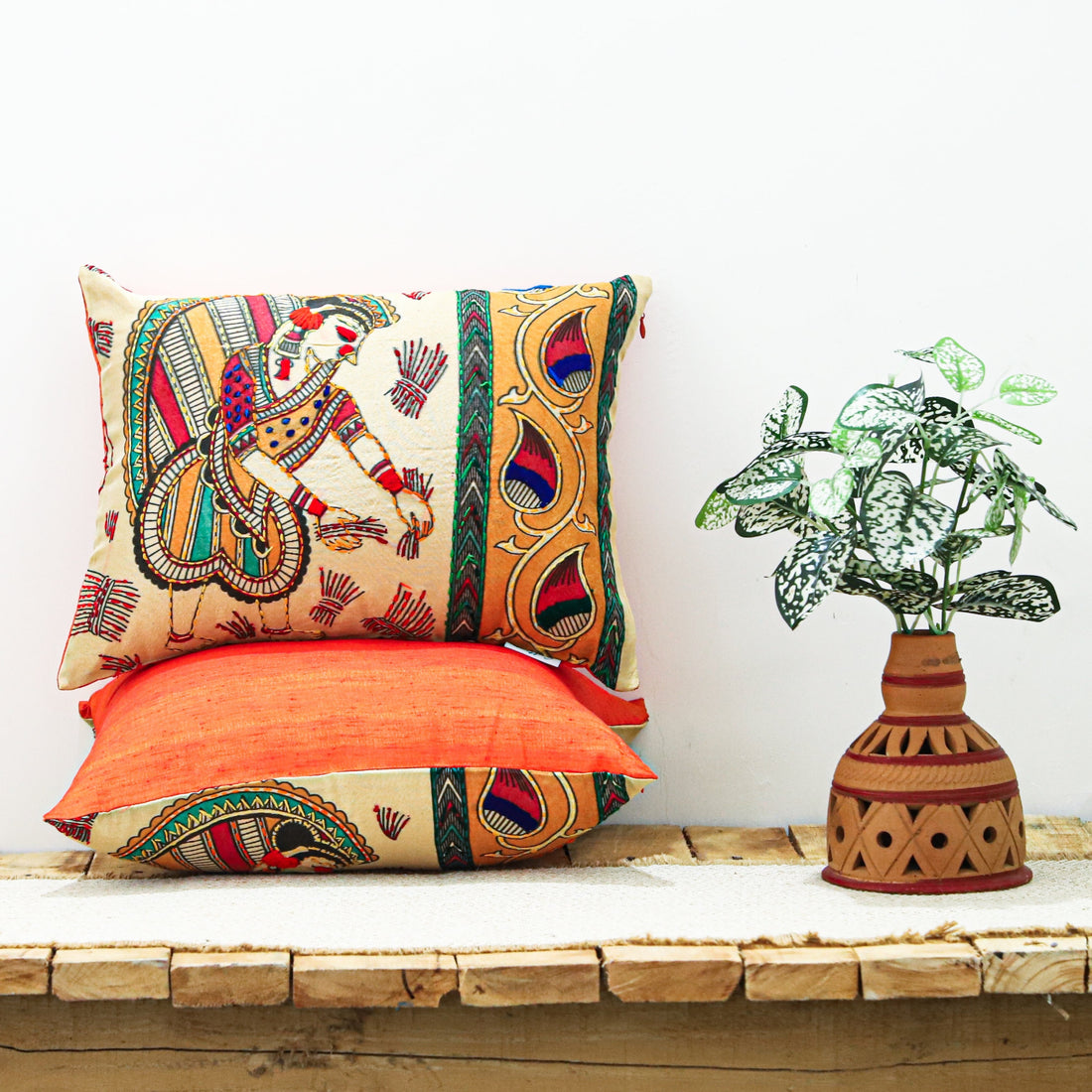 &quot;Block printed and hand-embroidered cushion cover featuring intricate designs, available in three sizes: 16x12 inches, 18x18 inches, and 24x16 inches. Perfect for adding a touch of artistry and elegance to any space.&quot;