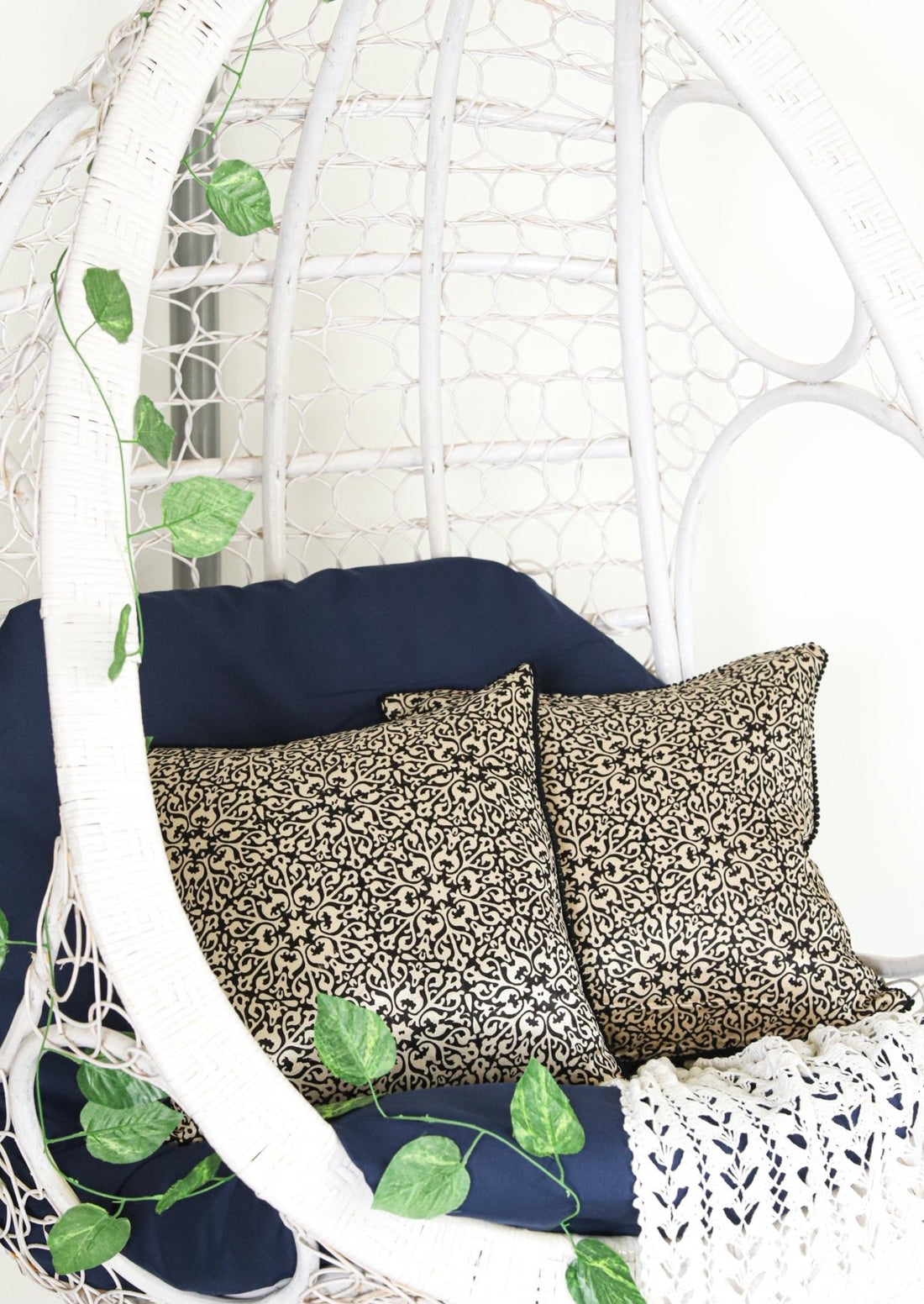 NOOR Ajrakh block-printed mashru cushion cover in rich, earthy tones featuring intricate patterns, available in sizes 16x16 inches and 18x18 inches. Perfect for adding a touch of elegance and cultural charm to your home decor