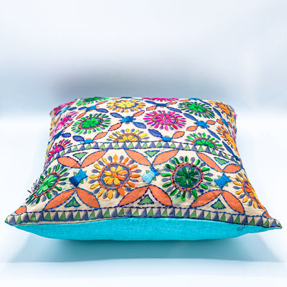 "Block printed and hand embroidered cushion cover in 18x18 size featuring intricate floral designs and vibrant colors, perfect for adding a touch of artistry to your home decor."